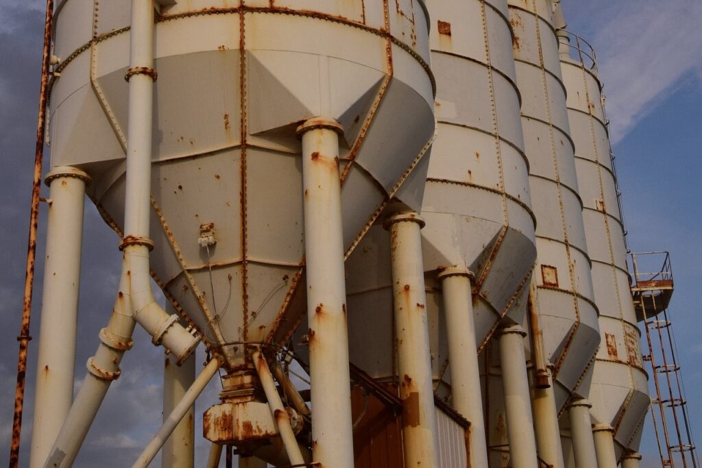 Cement storage silos with rust stains