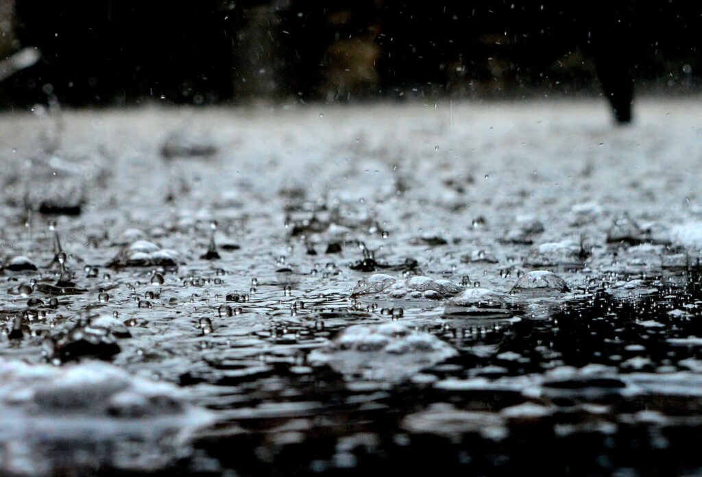 Water-covered ground amid a rainstorm