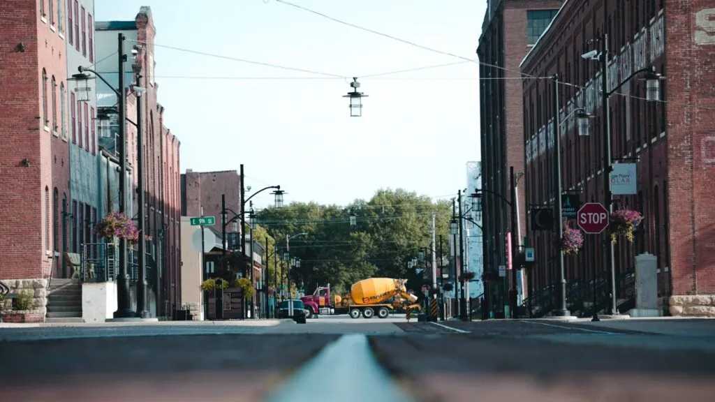 Ready mix concrete truck driving through a small-town intersection